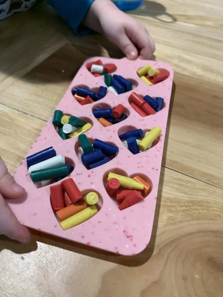 heart shaped mold filled with broken crayons