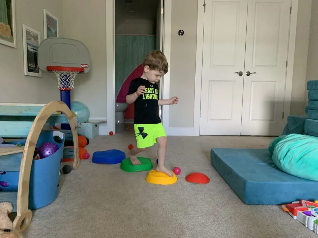 toddler stepping on stepping stones