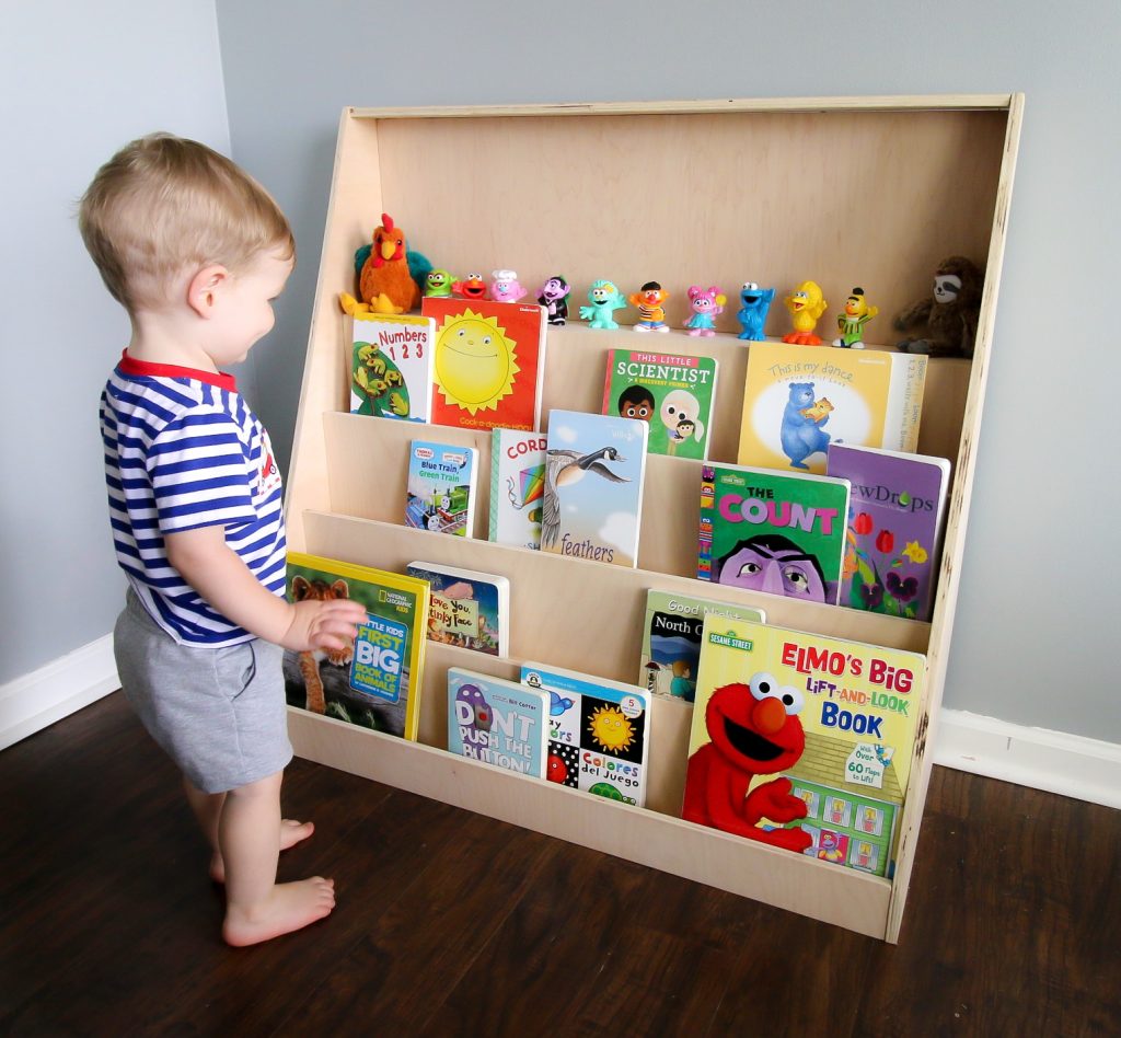 toddler looking at front facing bookshelf