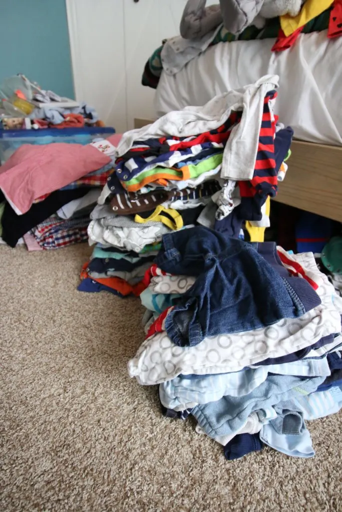 pile of baby clothes