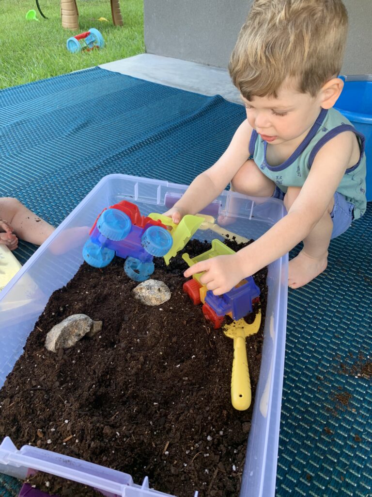 little blue truck dirt and mud sensory bin