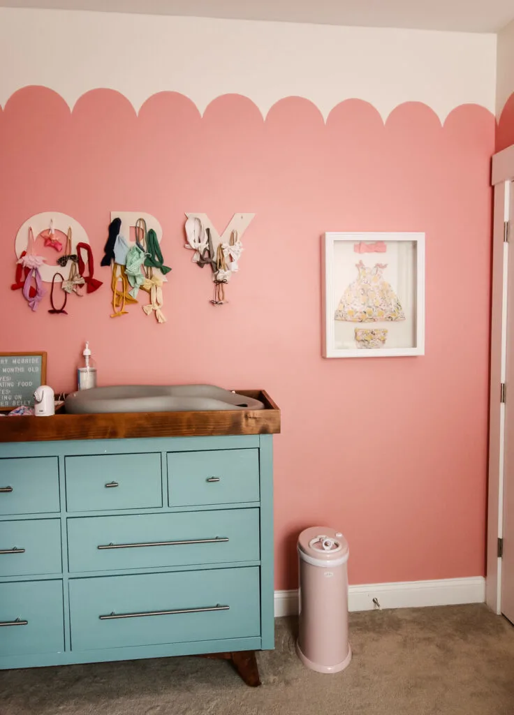 ubbi diaper pail in a pink nursery