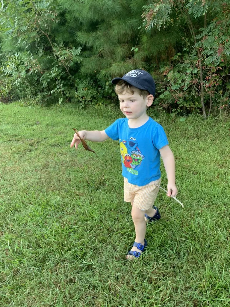 one year old on a nature hunt