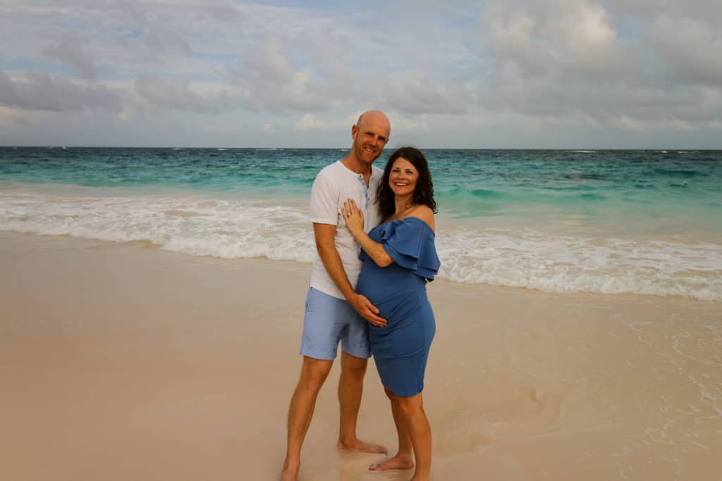 couples maternity photo on the beach