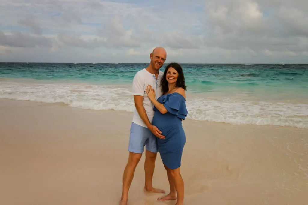 couples maternity photo on the beach