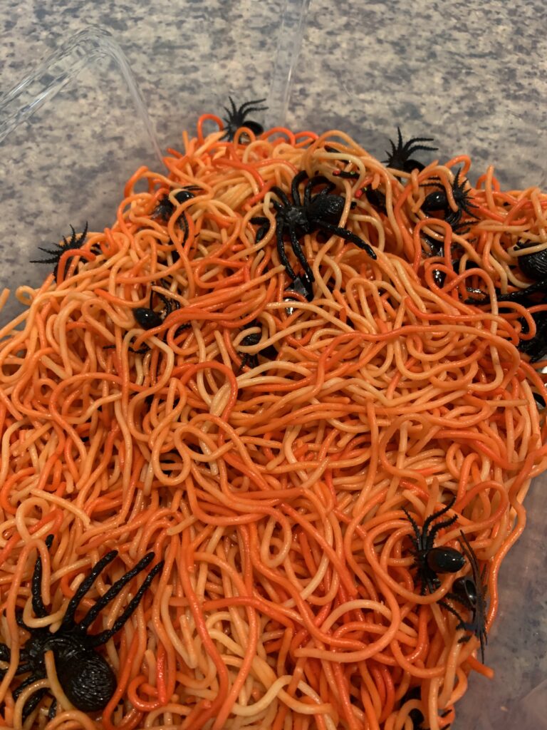 spider and spaghetti halloween sensory bin
