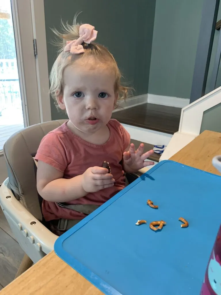 baby eating mini spider halloween donut