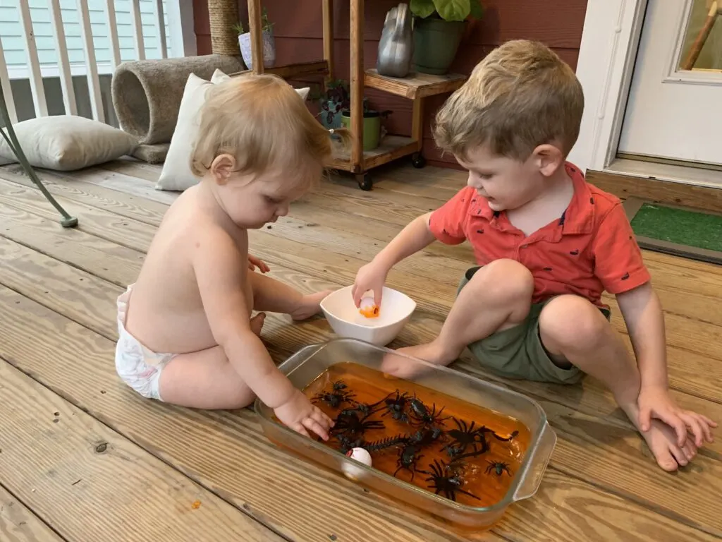 toddlers playing with halloween jello