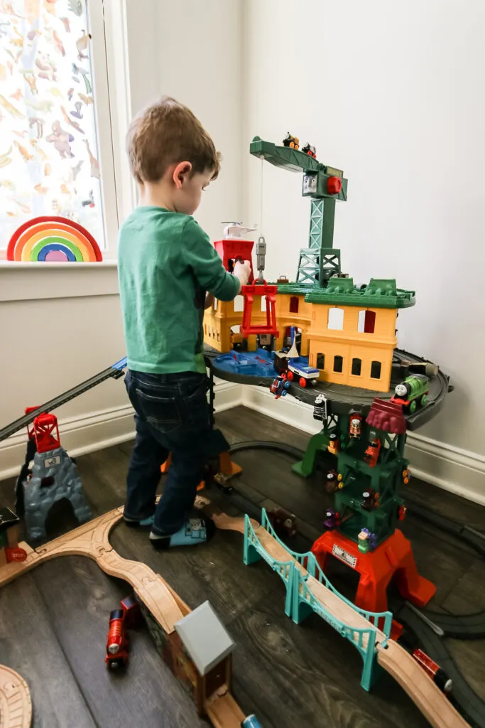 toddler playing with thomas super station
