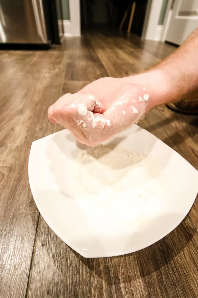 dipping hand in flour