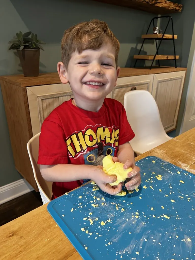 3 year old playing with cloud dough