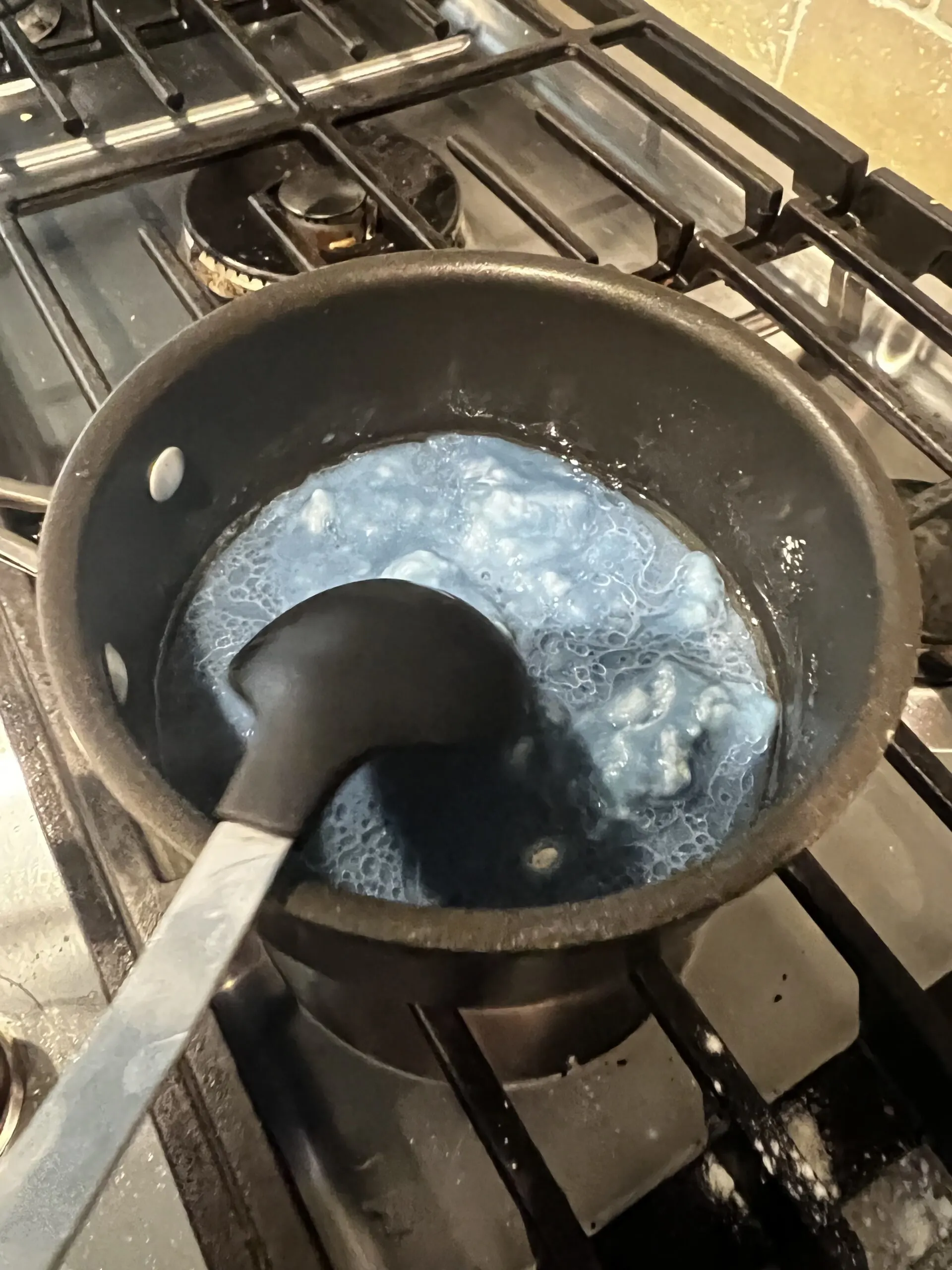 mixing play dough on the stove