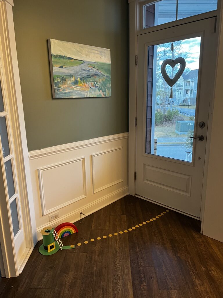leprechaun trap with trail of gold coins leading to the door