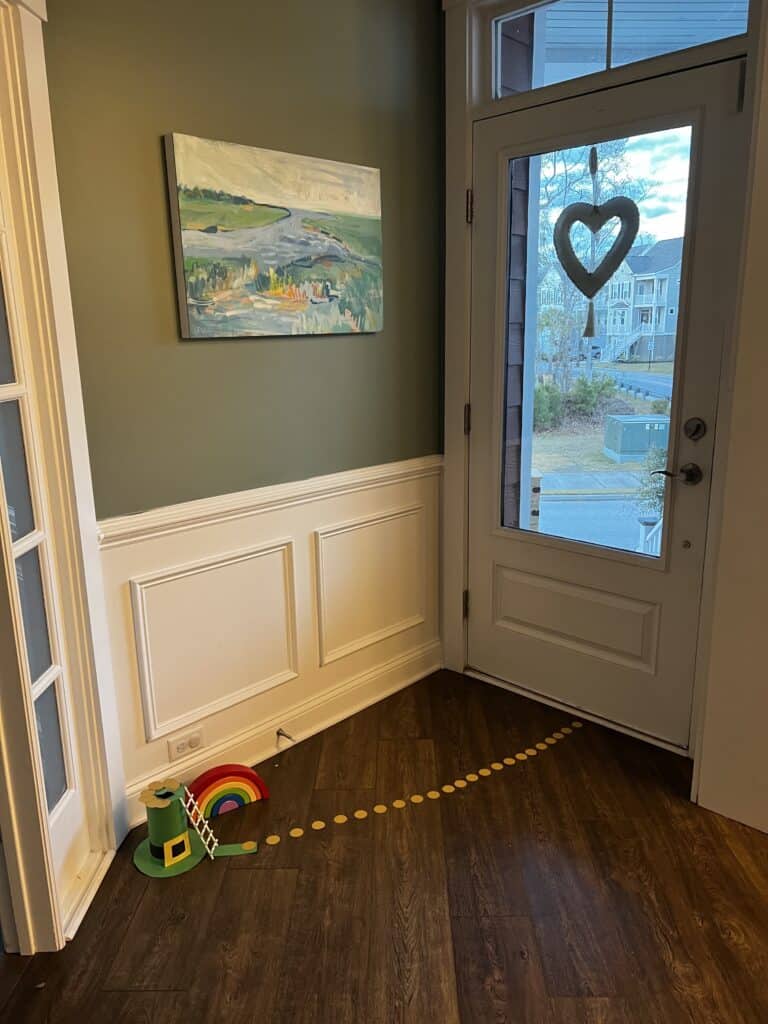 leprechaun trap with trail of gold coins leading to the door