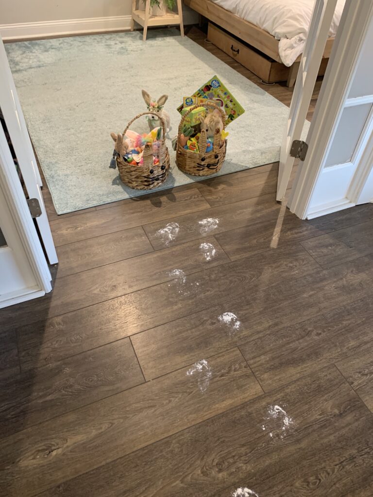 easter bunny footprints leading to easter baskets