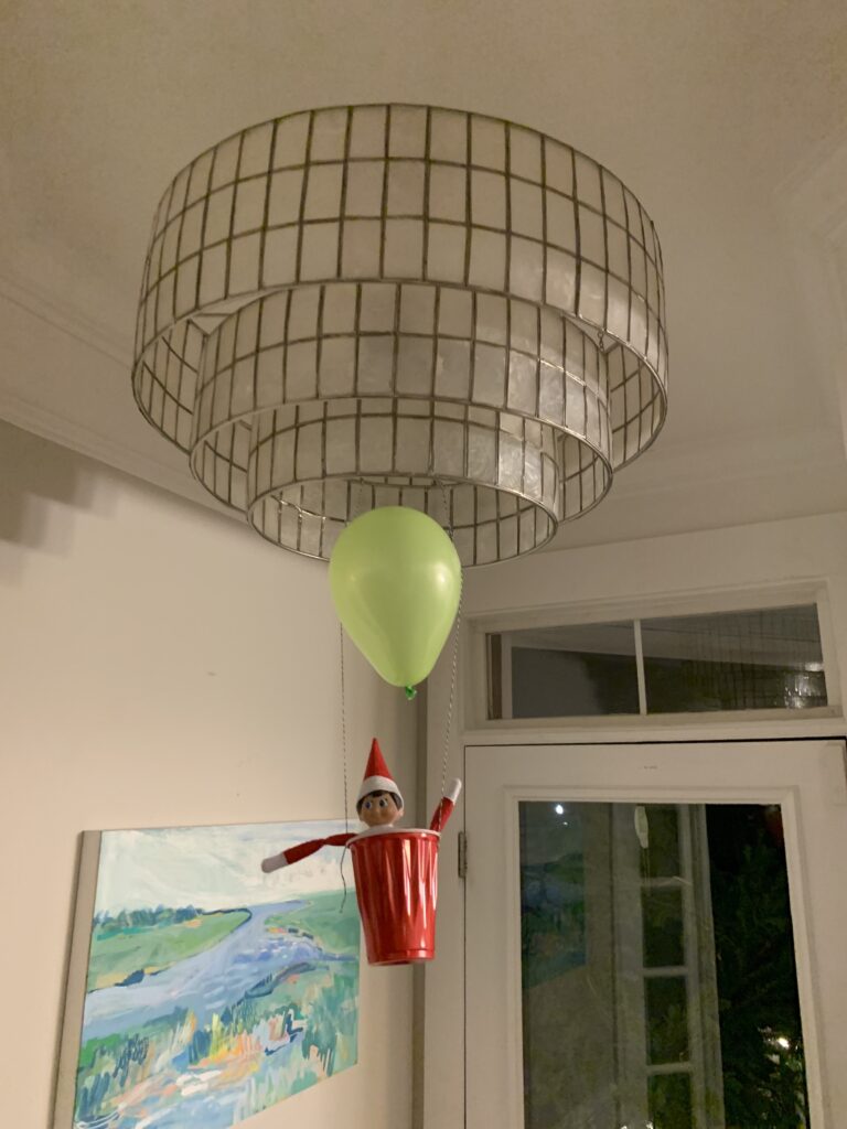 elf on a shelf in a hot air balloon