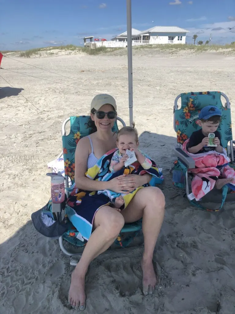 mom and toddlers in a beach chair