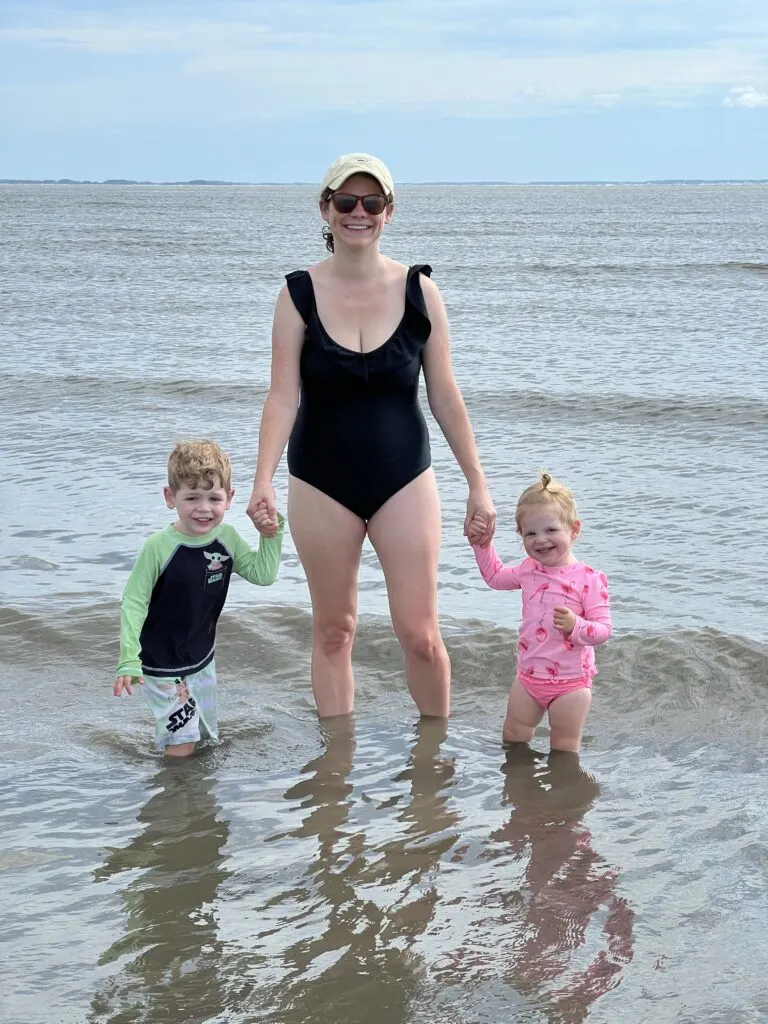 mom with toddlers in the ocean