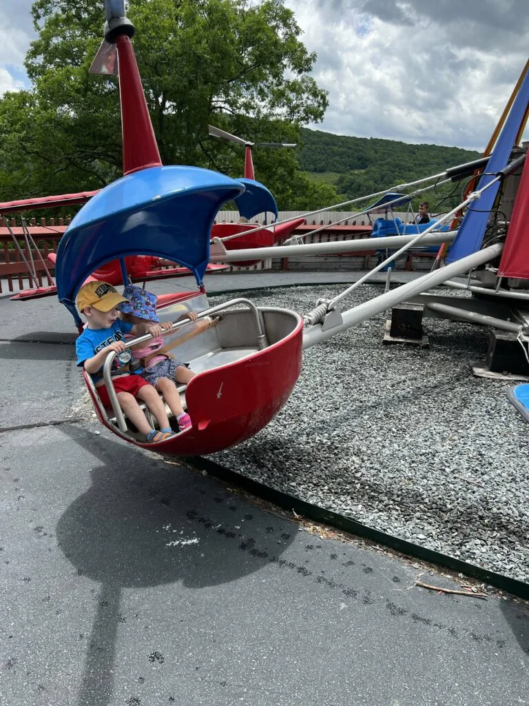 toddlers on a helocopter fair ride