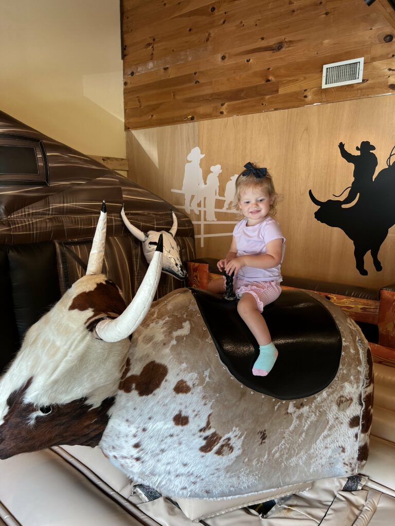 toddler on a bull riding