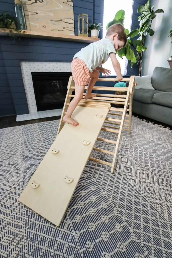 3 year old climbing a piccalio pikler triangle