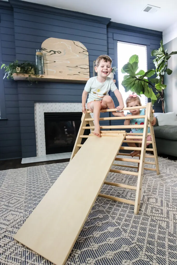 two kids climbing a piccalio pikler triangle