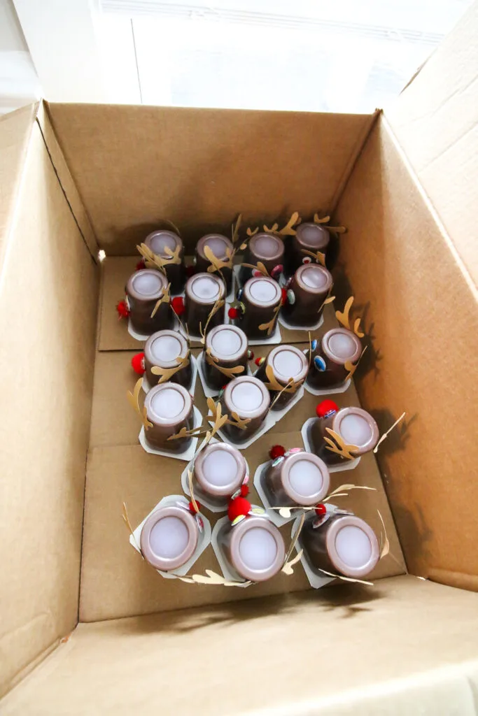 Reindeer pudding cups in a cardboard box