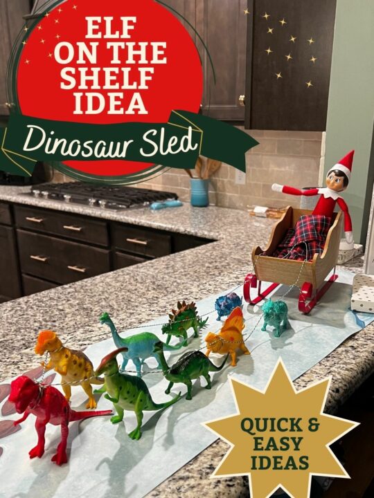 elf on the shelf idea - dinosaur sled