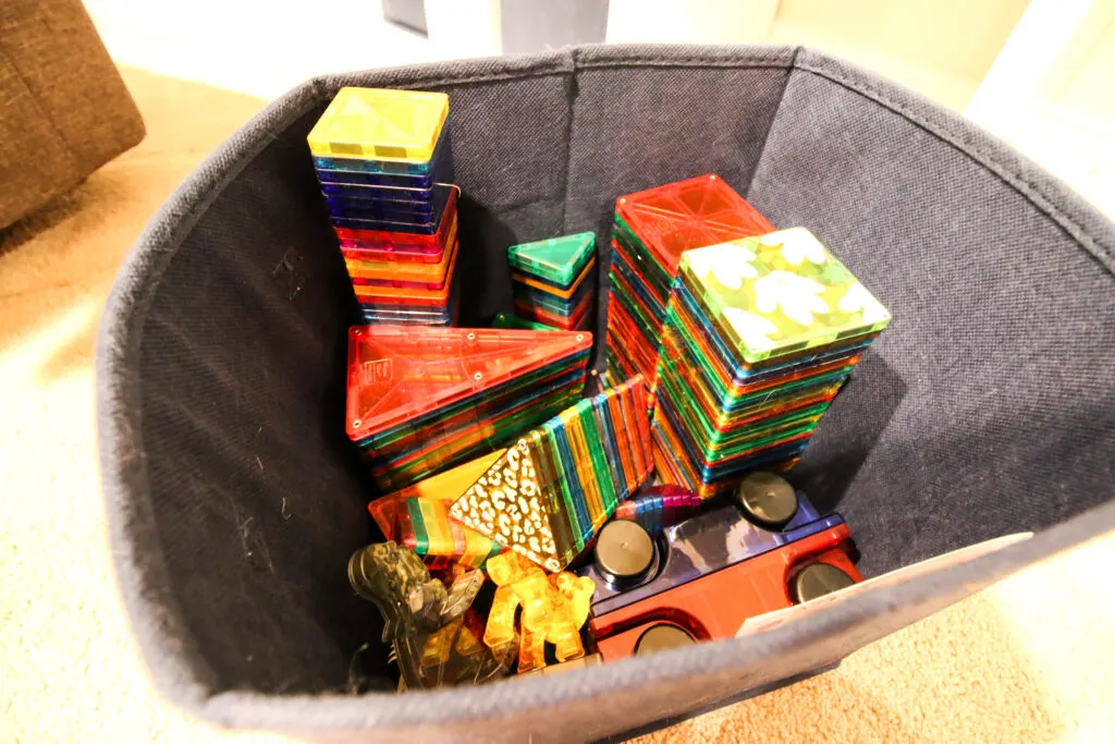 cube bin full of magnetic tiles