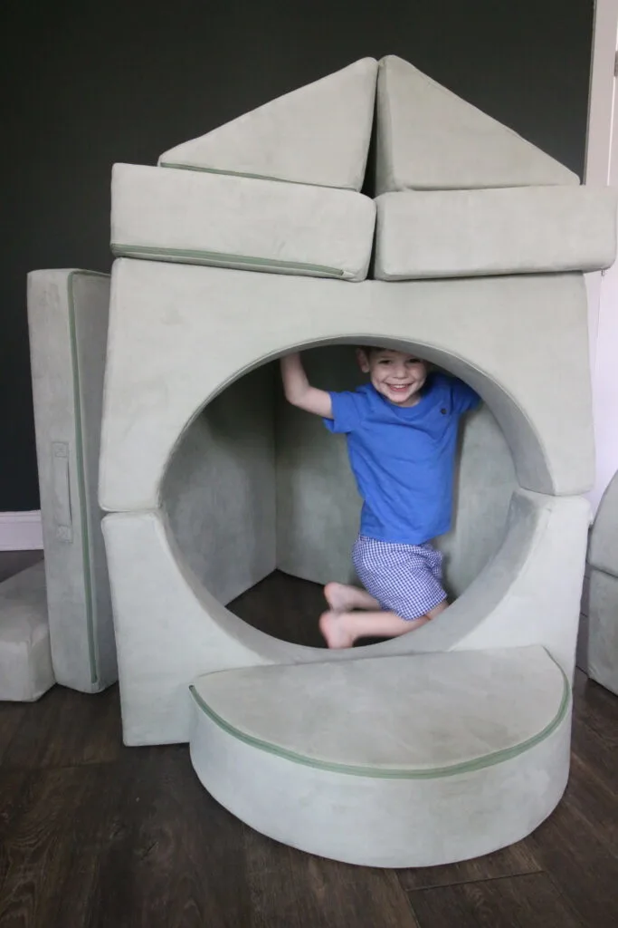 barumba play couch with a toddler playing inside it