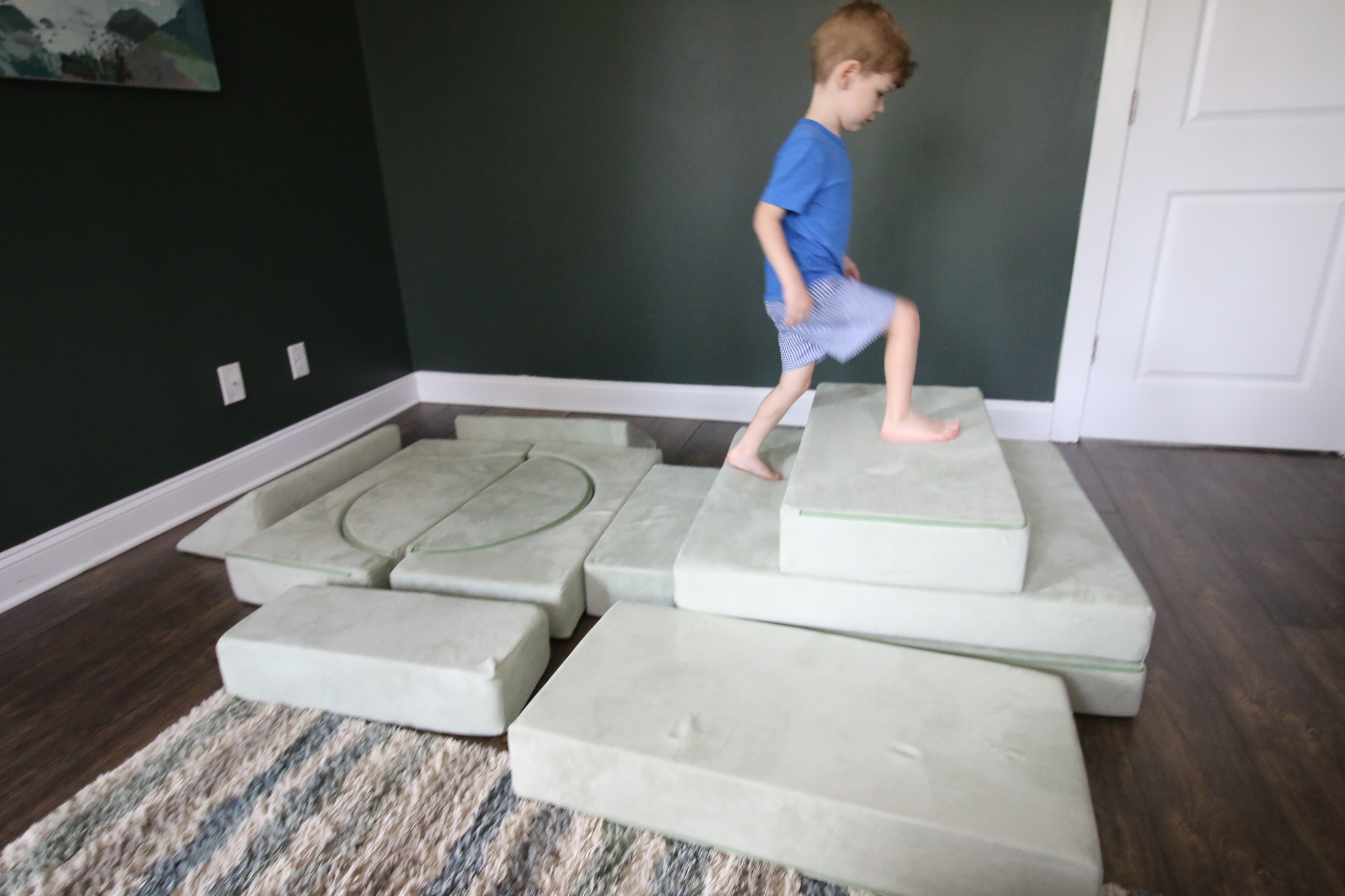 kid climbing on a barumba play couch