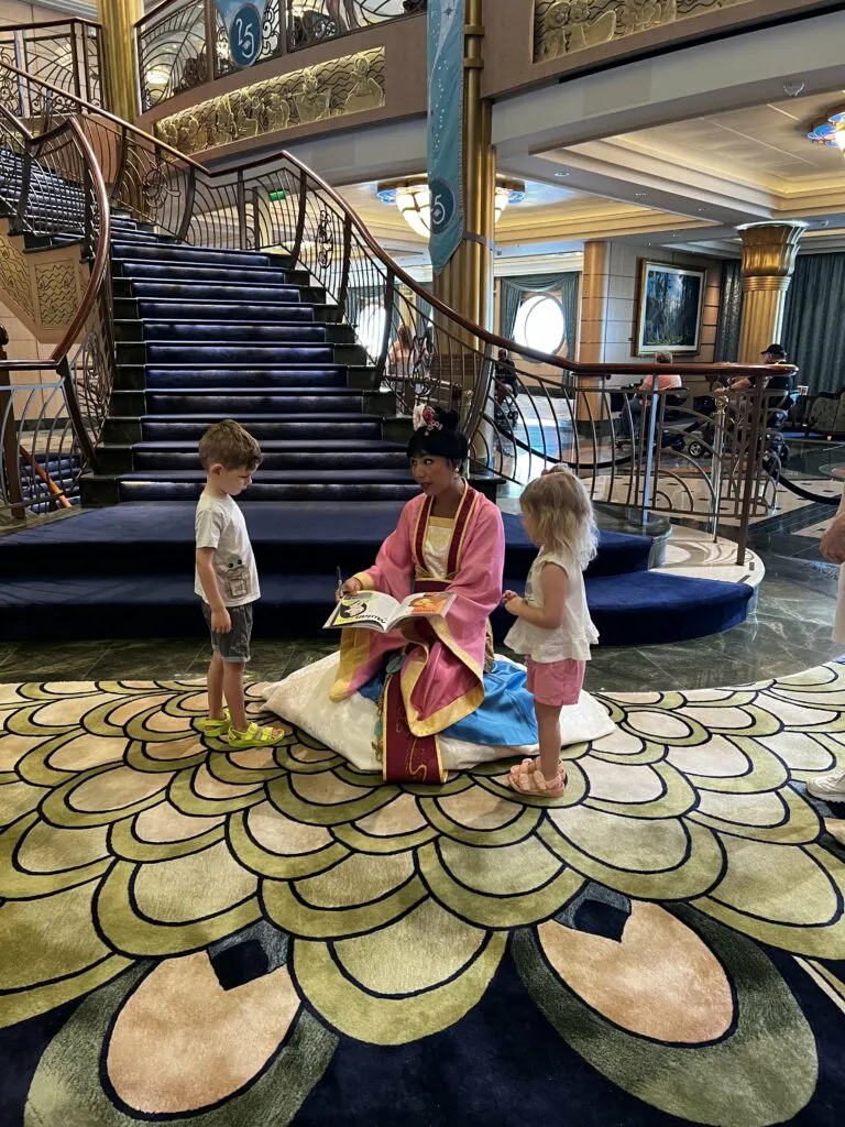 mulan signing our autograph book on a disney cruise