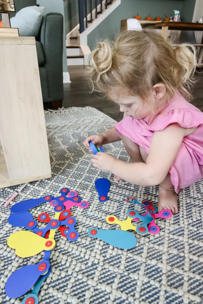 child building with clixo magnetic toy