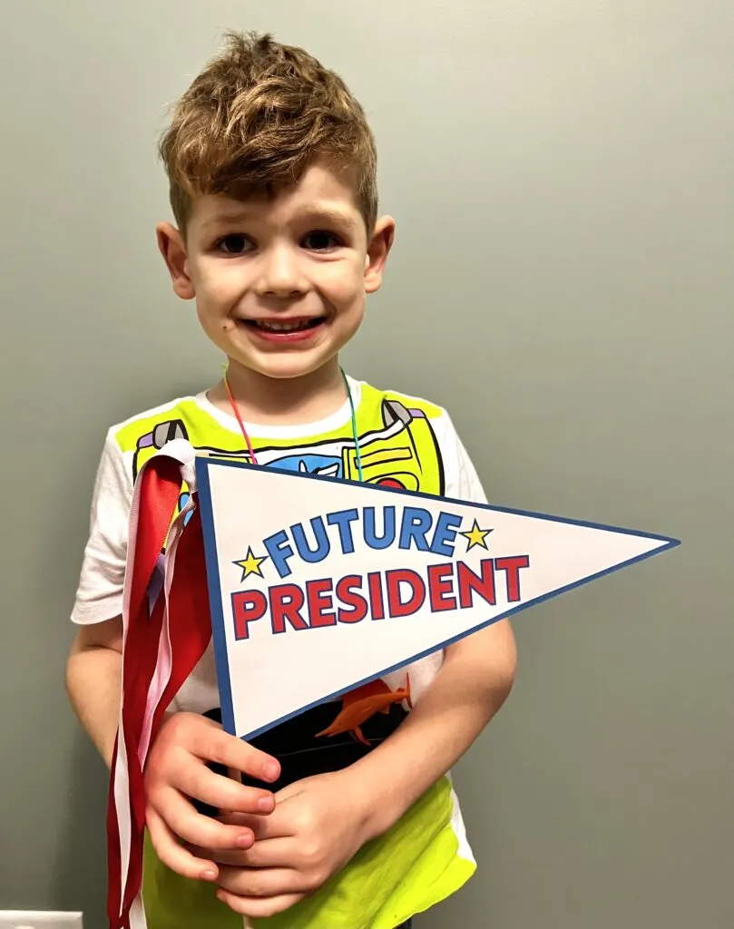 kid holding future president sign