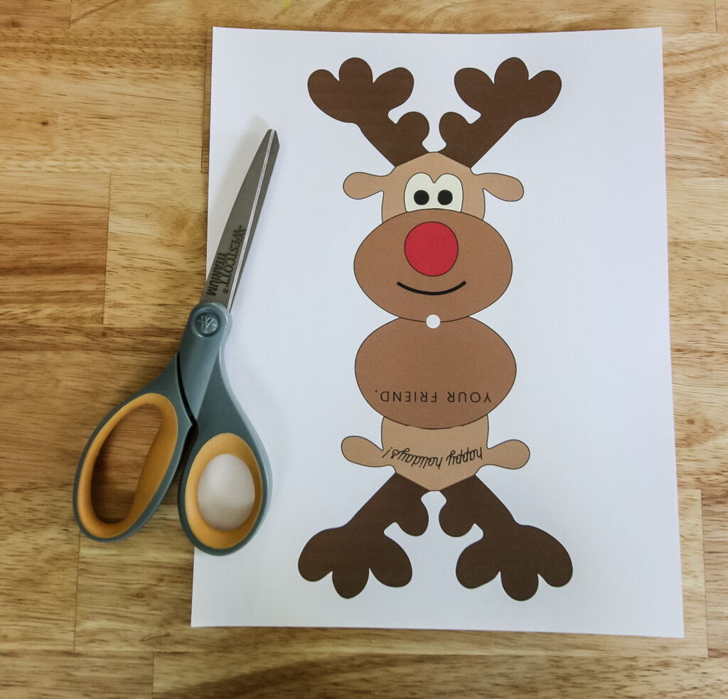 cutting out reindeer gift tags 