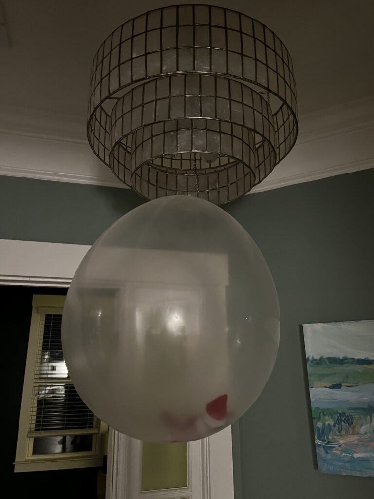 elf on the shelf inside a balloon