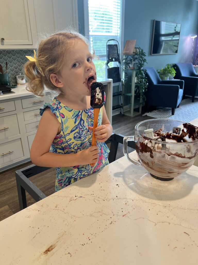 licking the spoon making halloween brownies