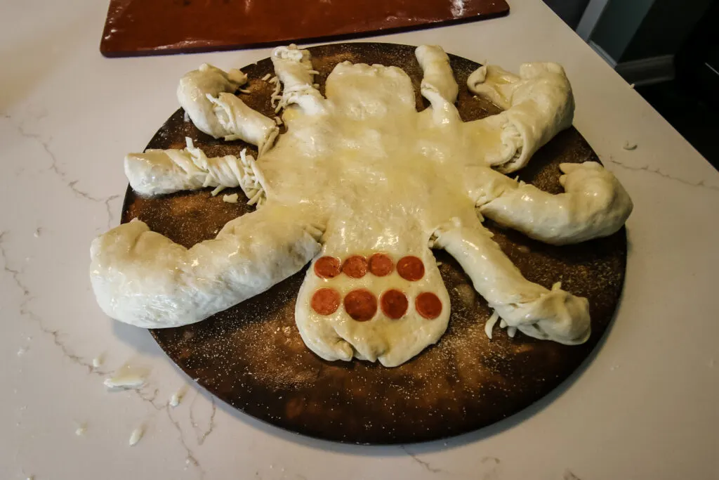 making a cheese bread spider for halloween