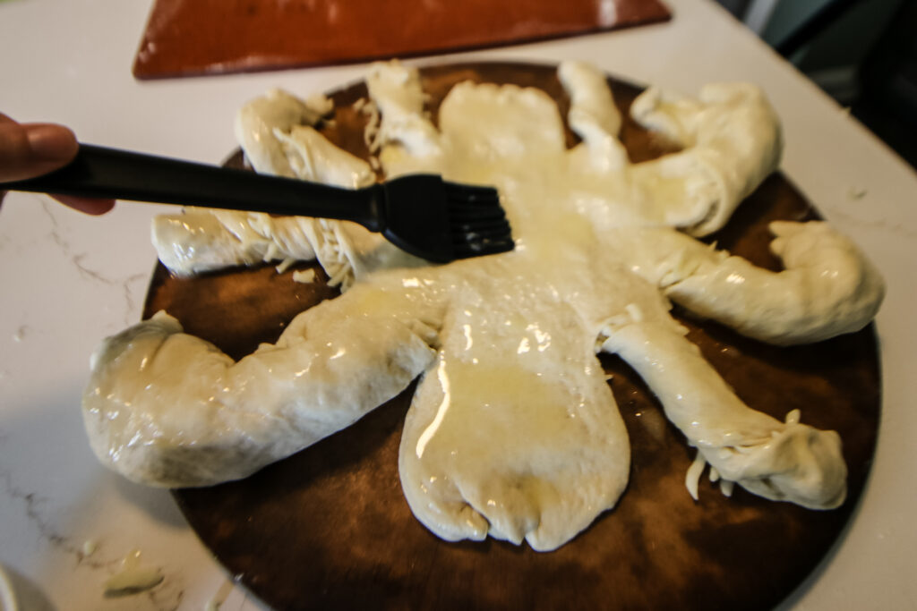 making a cheese bread spider for halloween