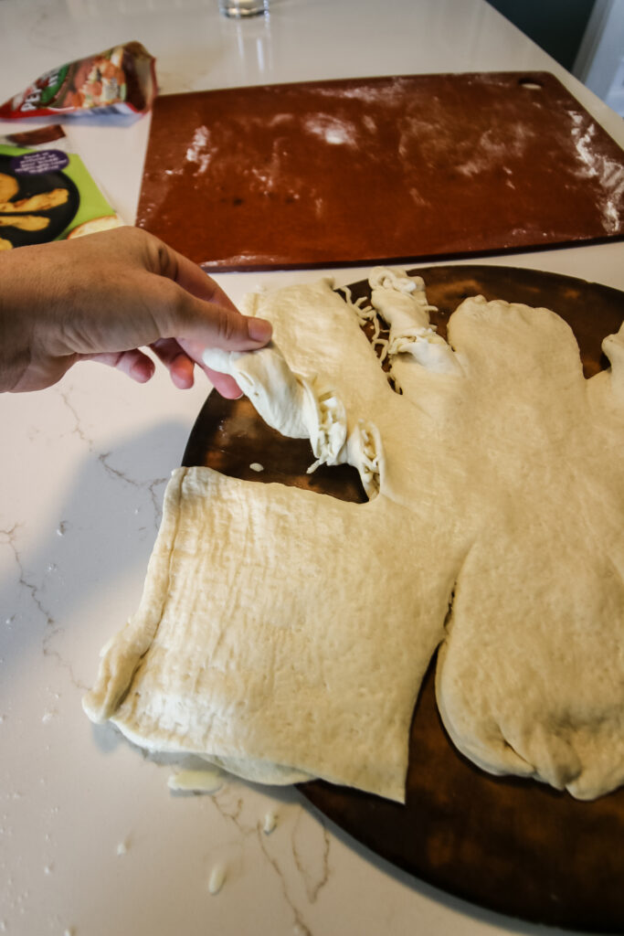 making a cheese bread spider for halloween