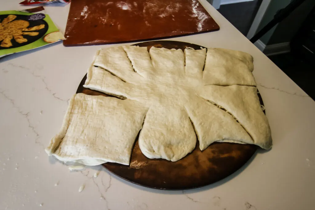 cheese bread cut to make a spider