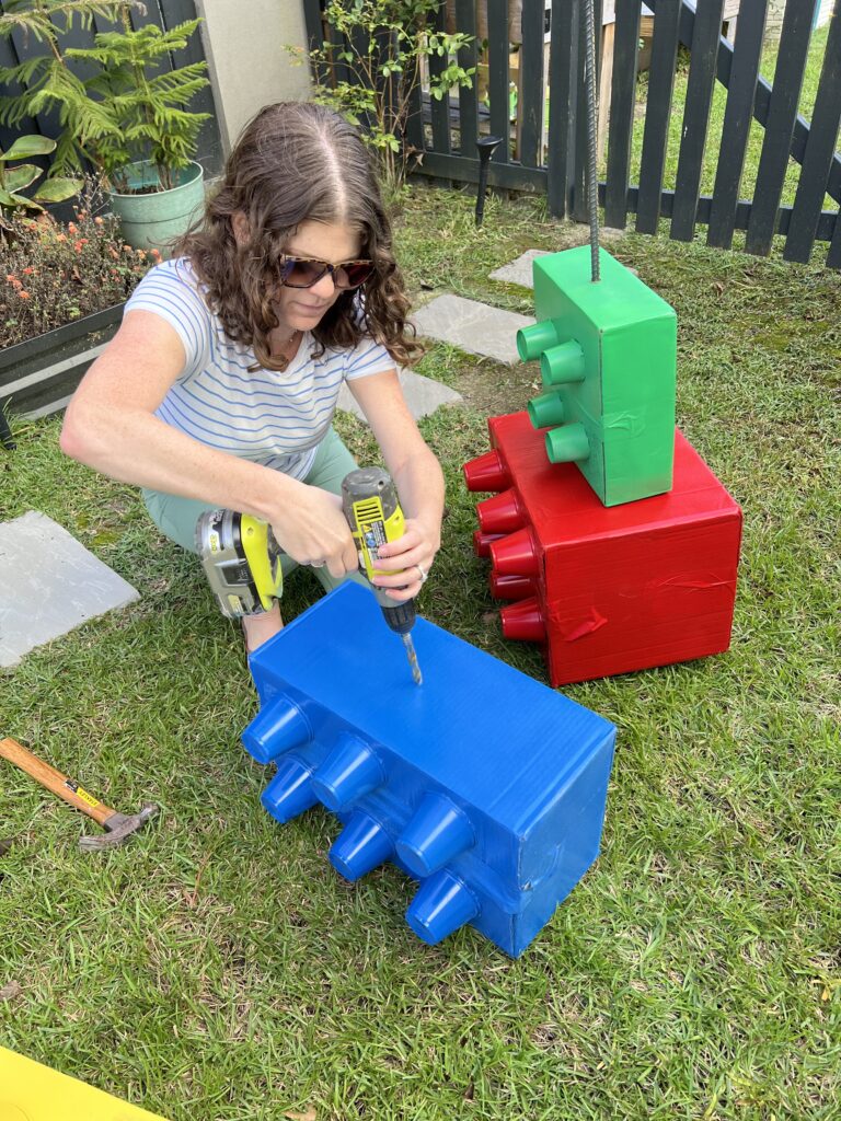 drilling holes in a cardboard box lego