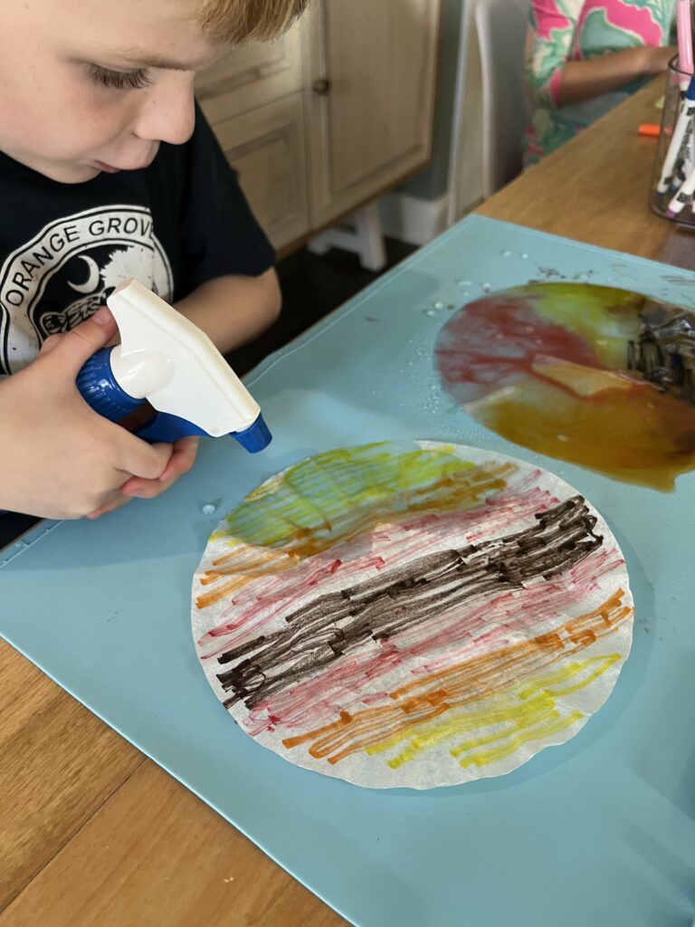 spraying water on coffee filters