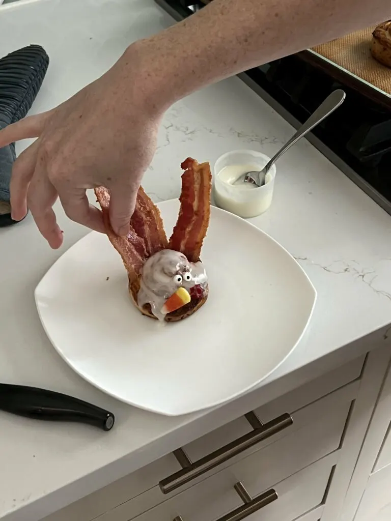 adding bacon to a turkey cinnamon roll