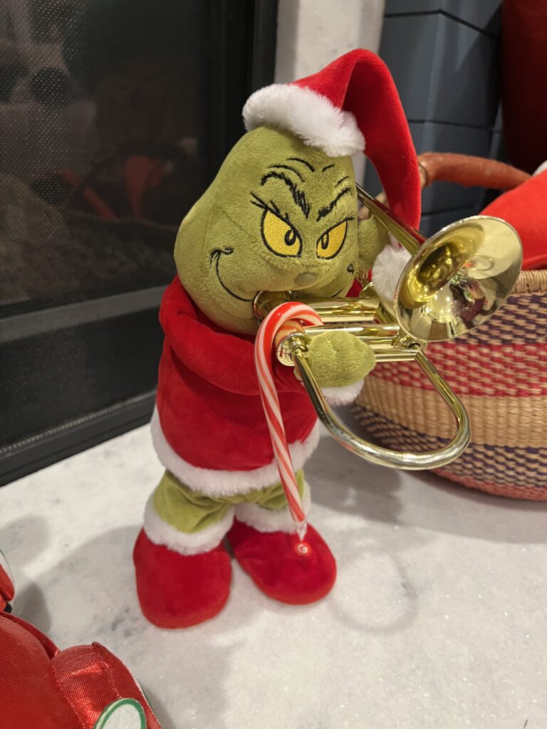 candy cane hanging on a grinch toy