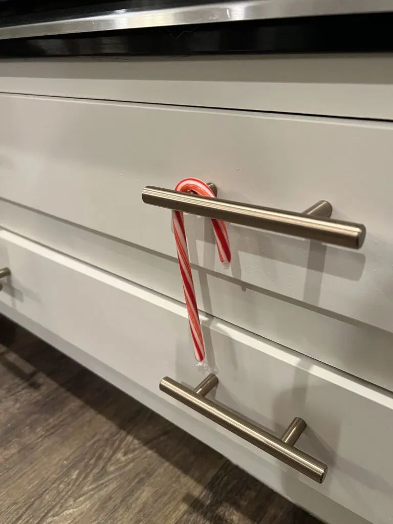 candy cane hanging on a drawer pull