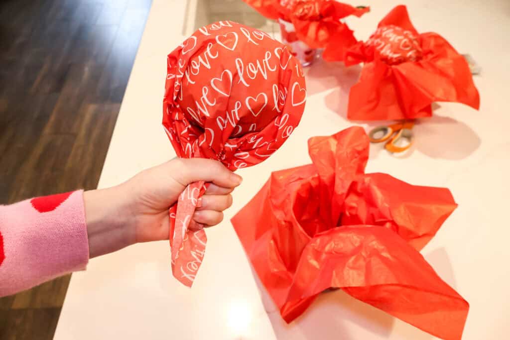 wrapping a foam ball in tissue paper