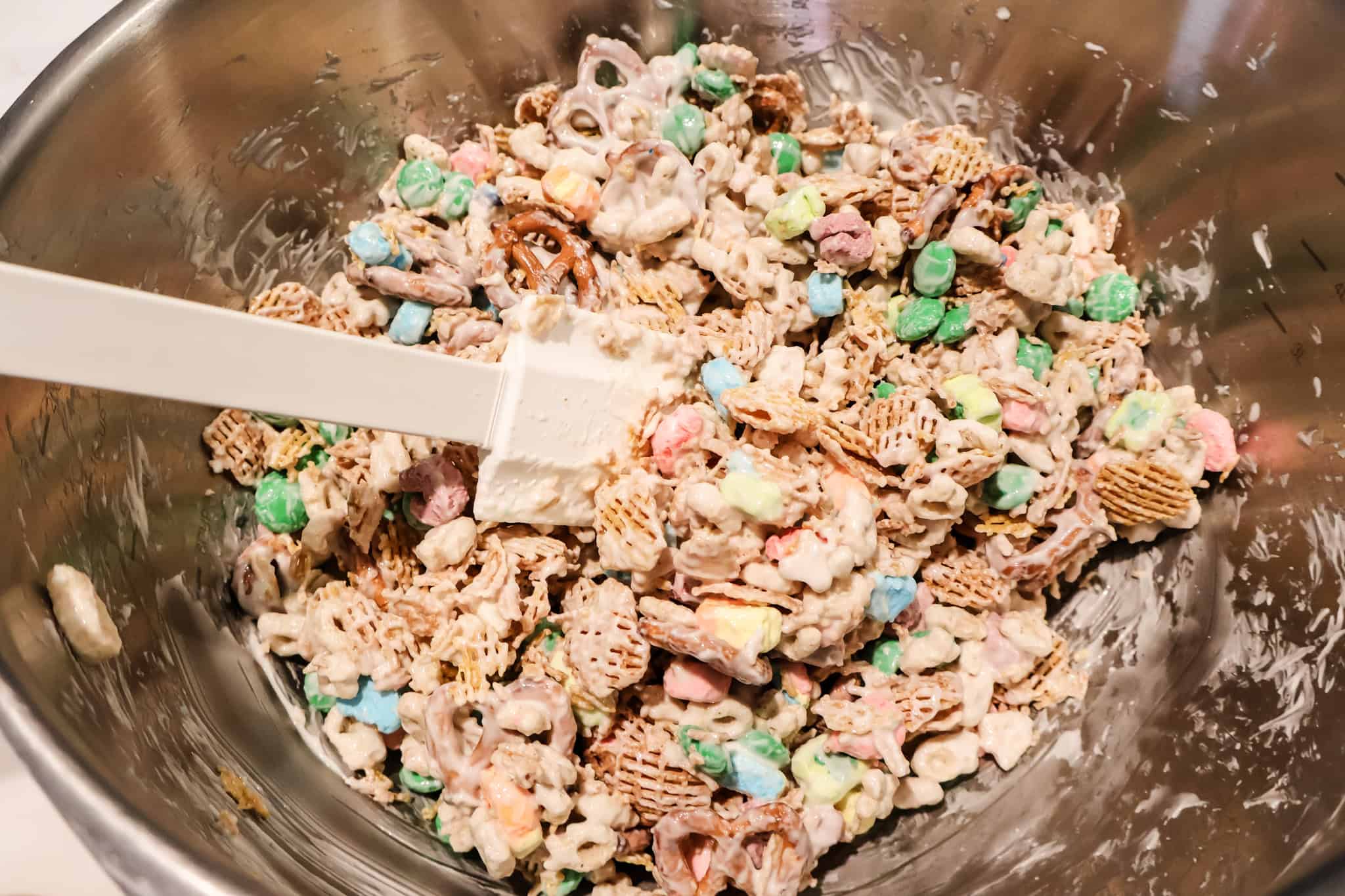 stirring st patricks day leprechaun bait treat mix