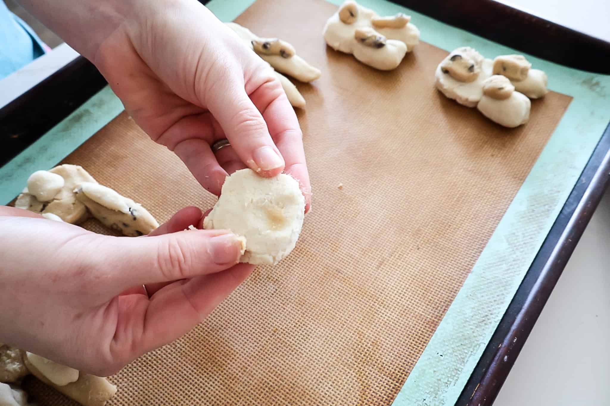 smuching a cookie dough ball