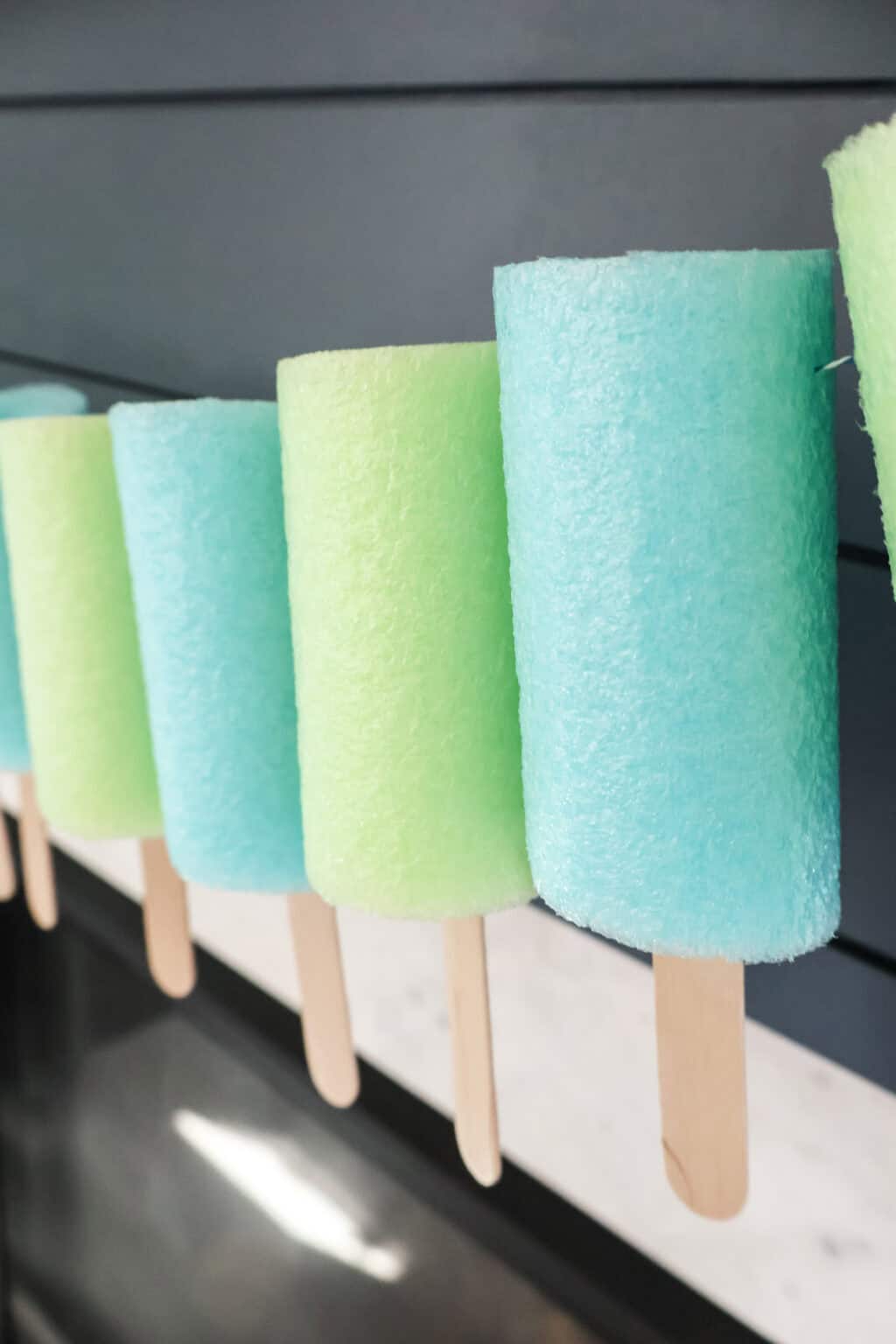 Pool Popsicles Easy DIY Pool Noodle Popsicle Banner - Celebrating with kids